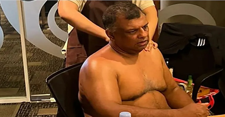 অফিসের মিটিংয়ে উদোম দেহে ম্যাসাজ নিচ্ছেন এয়ার এশিয়া প্রধান